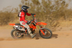 Expert Motorcycle Open racer competing in a bitd off-road race